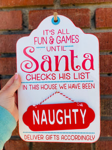 It's All Fun & Games Until Santa Checks His List Hanging Sign